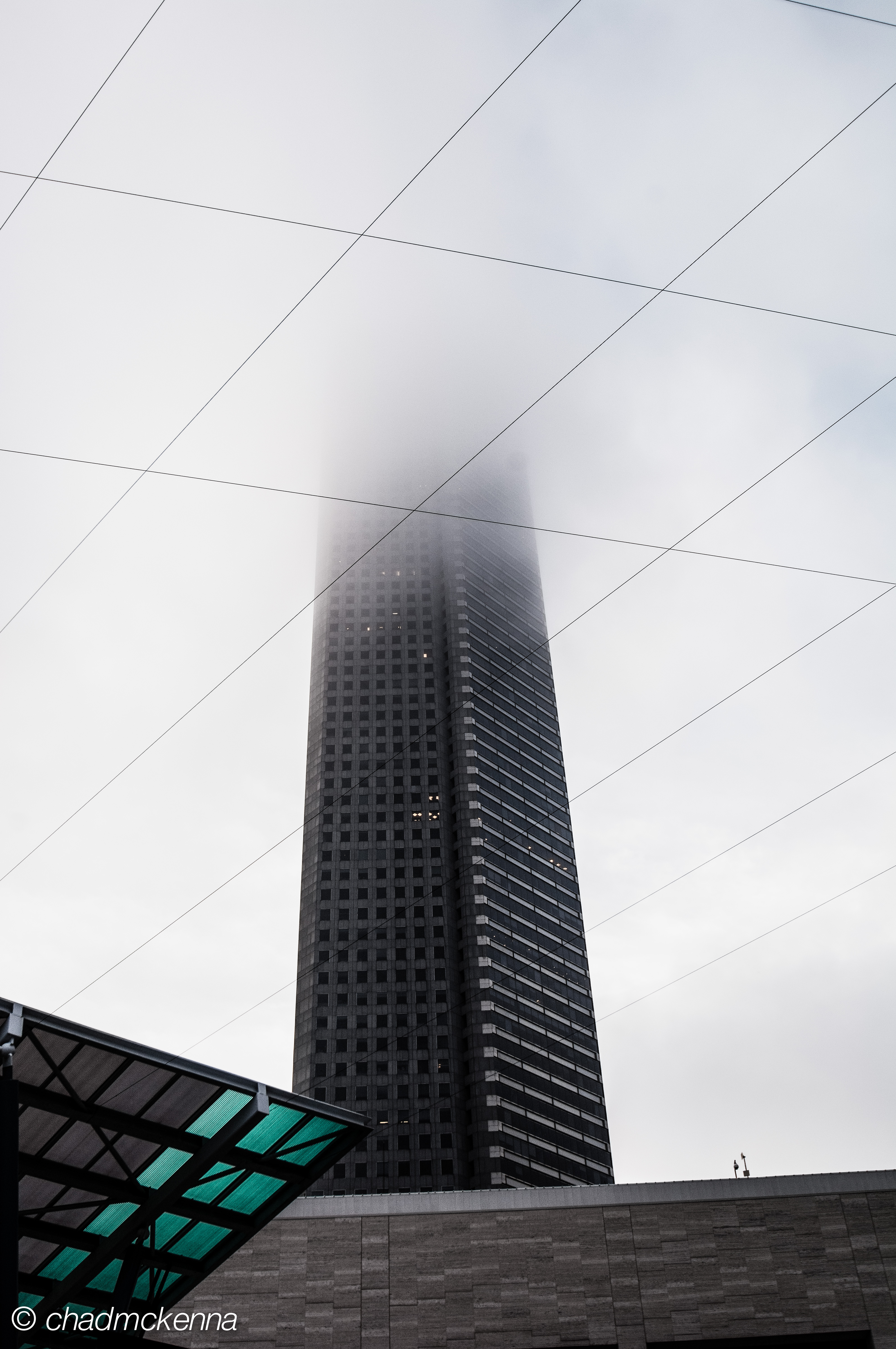 Building disappearing in the fog